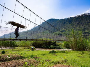 In remote parts of Rwanda, settlements on either side of a river might share services — a clinic and school on one side only, for example. A newly constructed bridge makes it easier to get to these vital services — and also allows farmers and other businesspeople to bring their goods from one community to another to sell.