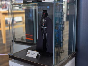 A Darth Vader figurine is on display. Foot-tall action figures were tariffed at 145% one point.
