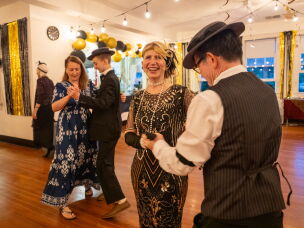 Buster Keaton Conference attendees Joy Blatchford (from left) dances with her son Aden Blatchford, while Katrina Nguyen dances with her husband Khoi Nguyen at a 1920s themed dance in Cottage Grove, Ore.