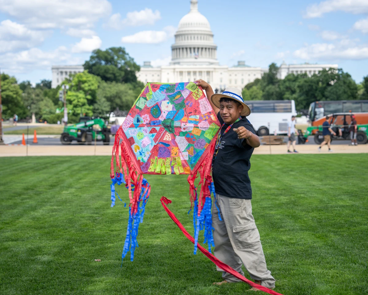 Ubaldo Sanchez is about to launch a traditional Guatemalan kite at the Folklife Festival.