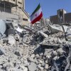 An Iranian flag is planted in the rubble of a police station, damaged in airstrikes yesterday, on March 3, 2026 in Tehran, Iran.