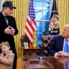President Trump is joined by Tesla and SpaceX CEO Elon Musk, and his son, X Musk, during an executive order signing in the Oval Office at the White House on Tuesday.