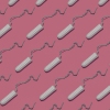 Diagonal rows of tampons against a pink background.