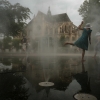Children cool off in a mist fountain in central Paris amid a heatwave, on Aug. 13.