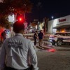 De politie staat bij een supermarkt die door brand is verwoest in Hermosillo, in de staat Sonora, Mexico, zaterdag 1 november 2025. (