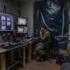 Callsign "Sonik", 34, сommander of the strike UAV platoon of Dovbush's hornets unit of 68th Separate Jäger Brigade watching unit's live streams. Donbas Region on Dec. 19, 2024.