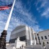 An American flag is seen outside the Supreme Court, in Washington, D.C., in November. This week, the high court will hear oral arguments for a case that could change who gets to be a U.S. citizen.