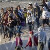 Unaccompanied minors walk towards U.S. Border Patrol vehicles after crossing over from Mexico on May 09, 2023, in El Paso, Texas.