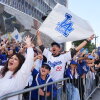 Fans cheer along the route during a parade to celebrate the Los Angeles Dodgers baseball team's World Series win on Monday, Nov. 3, 2025, in Los Angeles, Calif.