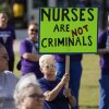 People demonstrate outside the courthouse where the sentencing hearing for former nurse RaDonda Vaught was held on May 13, 2022, in Nashville, Tenn.
