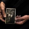 Nawaf Nasr, a 78-year-old member of Syria's Druze community, holds a creased black-and-white photo that he says shows him on horseback in a previous life before he died. The Druze religion holds that reincarnation is a path to spiritual purification.