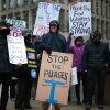 Protesters rally outside of the Theodore Roosevelt Federal Building headquarters of the U.S. Office of Personnel Management on February 5, 2025 in Washington, D.C.