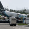 An Amazon cargo plane is seen after it crashed at Miami International Airport on Sunday in Miami. The Federal Aviation Administration said Prime Air Flight 7598 overran the runway while landing around 2 p.m. ET after departing from San Juan, Puerto Rico.