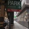 Signs direct traffic to the immigration court parking lot in Chicago, Ill., in August 2024.