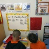 Students help put away supplies at the end of a reading and writing lesson at the Head Start program run by Easterseals, an organization that gets about a third of its funding from the federal government, on Jan. 29 in Miami.