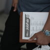 SUNRISE, FLORIDA - SEPTEMBER 25: A job seeker holds paperwork during the Mega JobNewsUSA South Florida Job Fair held in the Amerant Bank Arena on September 25, 2026 in Sunrise, Florida. Hiring managers and recruiters from more than 50 companies attended the job fair to recruit workers for opportunities across a range of companies. (Photo by Joe Raedle/Getty Images)
