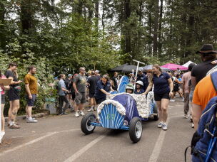 Team members at the Portland Adult Soapbox Derby guide their vehicles to the starting line on August 15, 2026 in Portland, Ore.