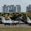 Taiwanese air force Mirage 2000 fighter jets wait for take off at a base in Hsinchu in northern Taiwan on Thursday.