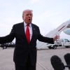 President Trump gives brief remarks to members of the press after exiting Air Force One on Sunday.
