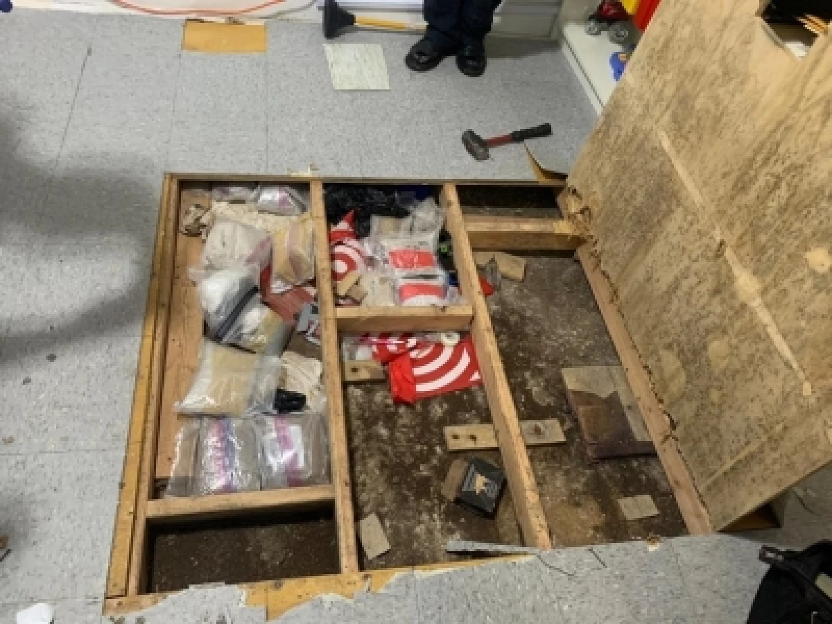 Four children under the age of 3 were poisoned — one fatally — by opioids at a day care in the Bronx, N.Y. Here, a 'trap,' a hidden compartment holding drugs under the day care's floor, is seen in an image from a Drug Enforcement Administration affidavit. Official say a search turned up fentanyl and drug-processing equipment at the day care.