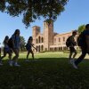Students walk past Royce Hall at the UCLA campus in Los Angeles on Aug. 15, 2024.
