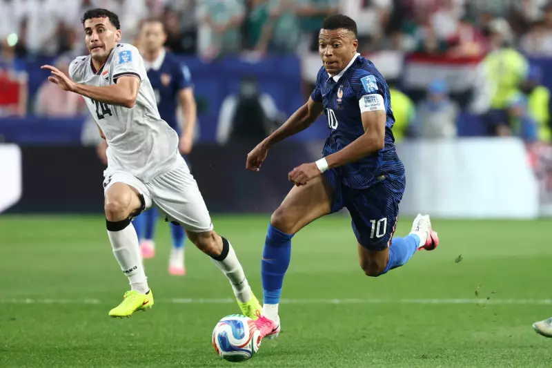 France forward Kylian Mbappé (r) runs with the ball past Iraq's midfielder Zaid Ismael during a World Cup Group I match in Philadelphia on June 22, 2026.