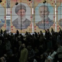 Iranian worshippers perform their Friday prayers under the portraits of the late Iranian Supreme Leader Ayatollah Ali Khamenei (second left) and top military officials who were killed during the U.S.-Israel campaign, at the Tehran University campus, in Tehran, Iran, on April 24.
