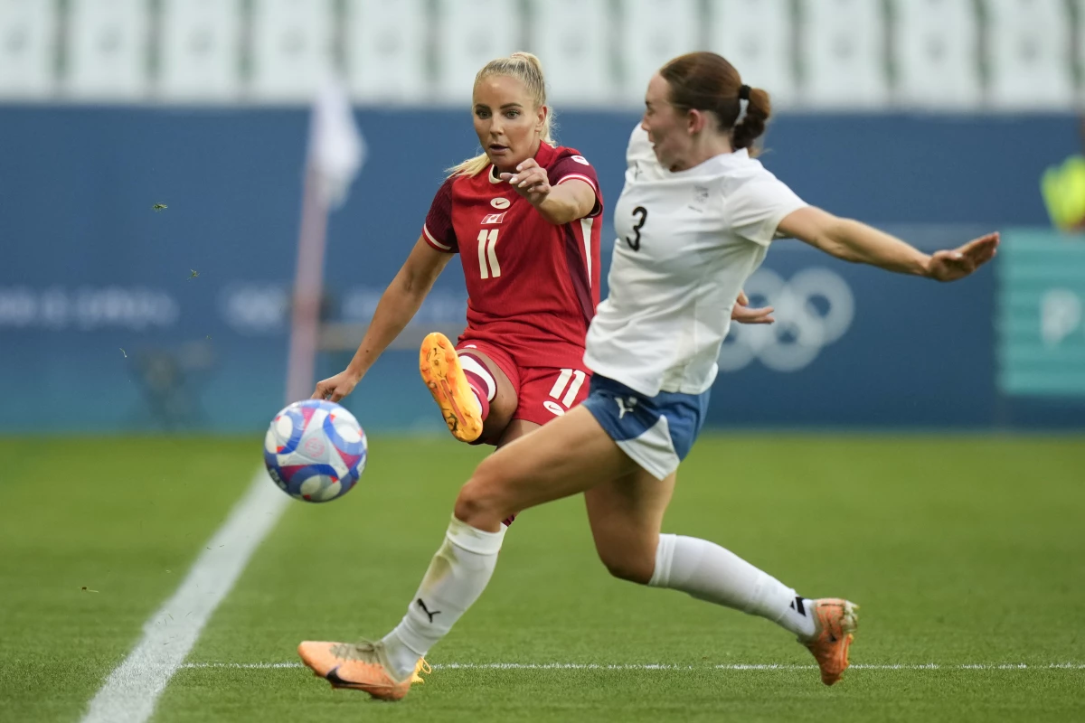 Canada's Adriana Leon, left, and New Zealand's Mackenzie Barry fight for the ball during the women's group match between Canada and New Zealand the 2024 Summer Olympics in Saint-Etienne, France on Thursday.