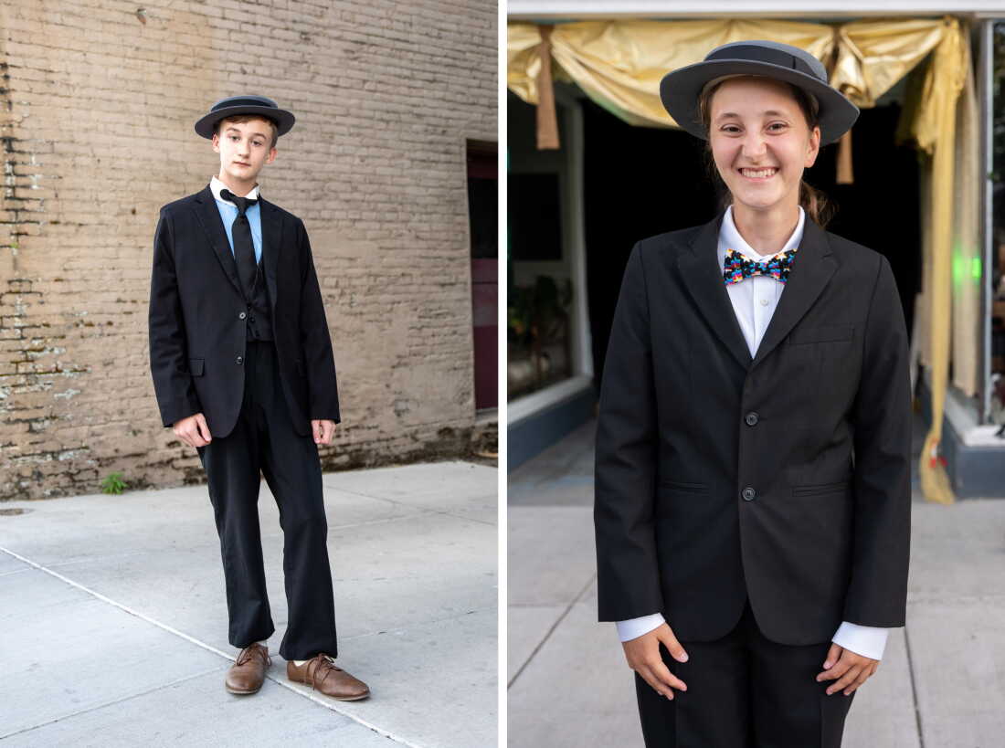 Aden Blatchford, 13, from Ontario, Canada and Chloe Fadem, 21, from Chicago dress up as Buster KEaton. Both are wearing dark suits and porkpie hats.