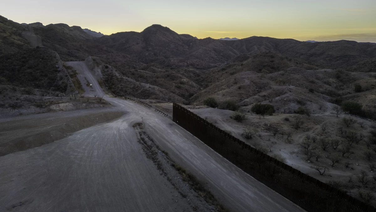 From an aerial view, the U.S.-Mexico border fence ends with a gap on Jan. 20, 2025 near Sasabe, Ariz. Republicans' tax and spending bill includes $46.5 billion for border wall projects.
