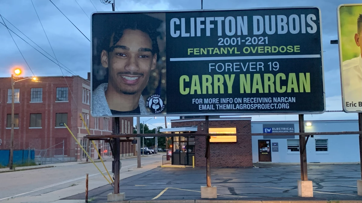 A memorial billboard posted in downtown Woonsocket, R.I. in 2023, by friends of Jennifer Dubois. The billboard features her 19-year-old son, Clifton, who died in 2020 of a drug overdose.