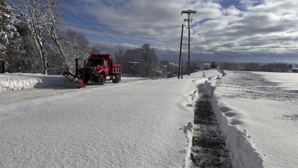 A snowplow on rounds in Lowville, N.Y., on Monday, Dec. 2, 2024.