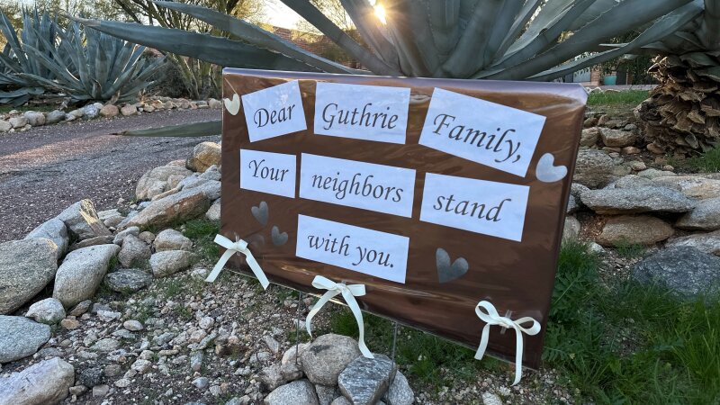 A sign put up by neighbors of Nancy Guthrie, the mother of "Today" host Savannah Guthrie, expresses support for the family.