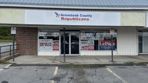 Campaign signs fill the windows of the Aroostook County Republican campaign headquarters in Caribou, Maine.
