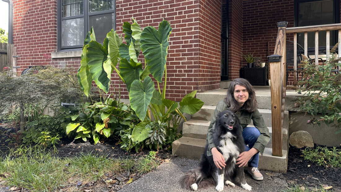Kelly MacDonald holds her dog in front of her five bedroom home in a Cincinnati suburb on September, 11 2026.