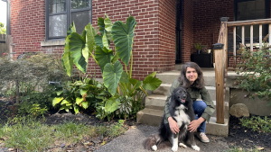 Kelly MacDonald holds her dog in front of her five bedroom home in a Cincinnati suburb on September, 11 2026.