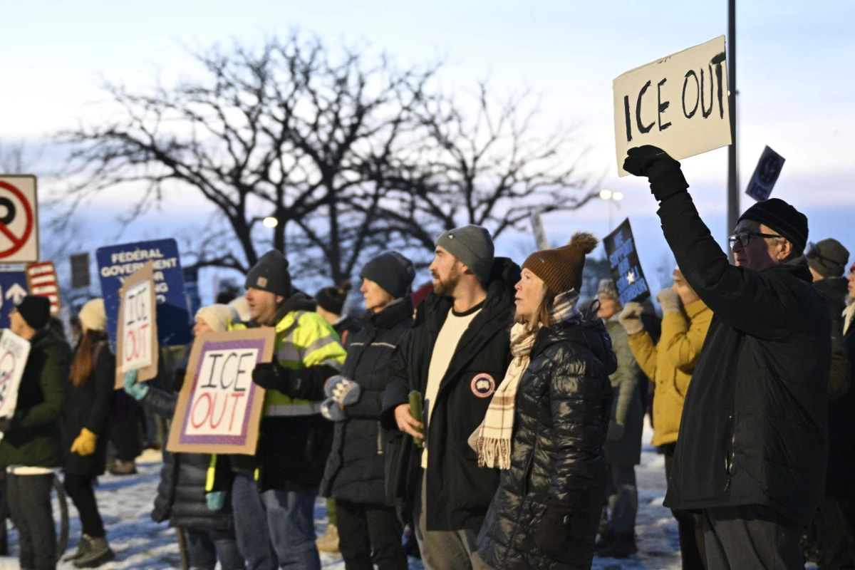 Protesters gather outside the Bishop Henry Whipple Federal Building, on Thursday, near Minneapolis.