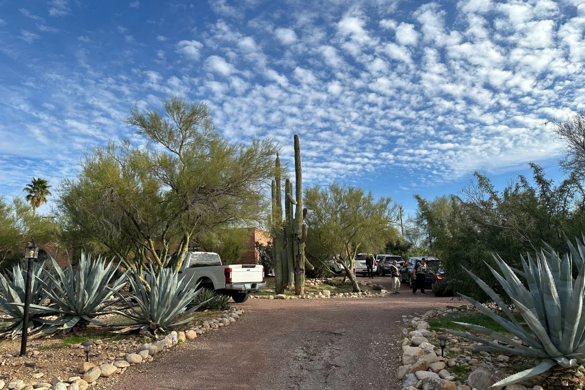 Law enforcement officers are seen at the home of Nancy Guthrie, the mother of Today co-host Savannah Guthrie, near Tucson, Ariz., on Monday.