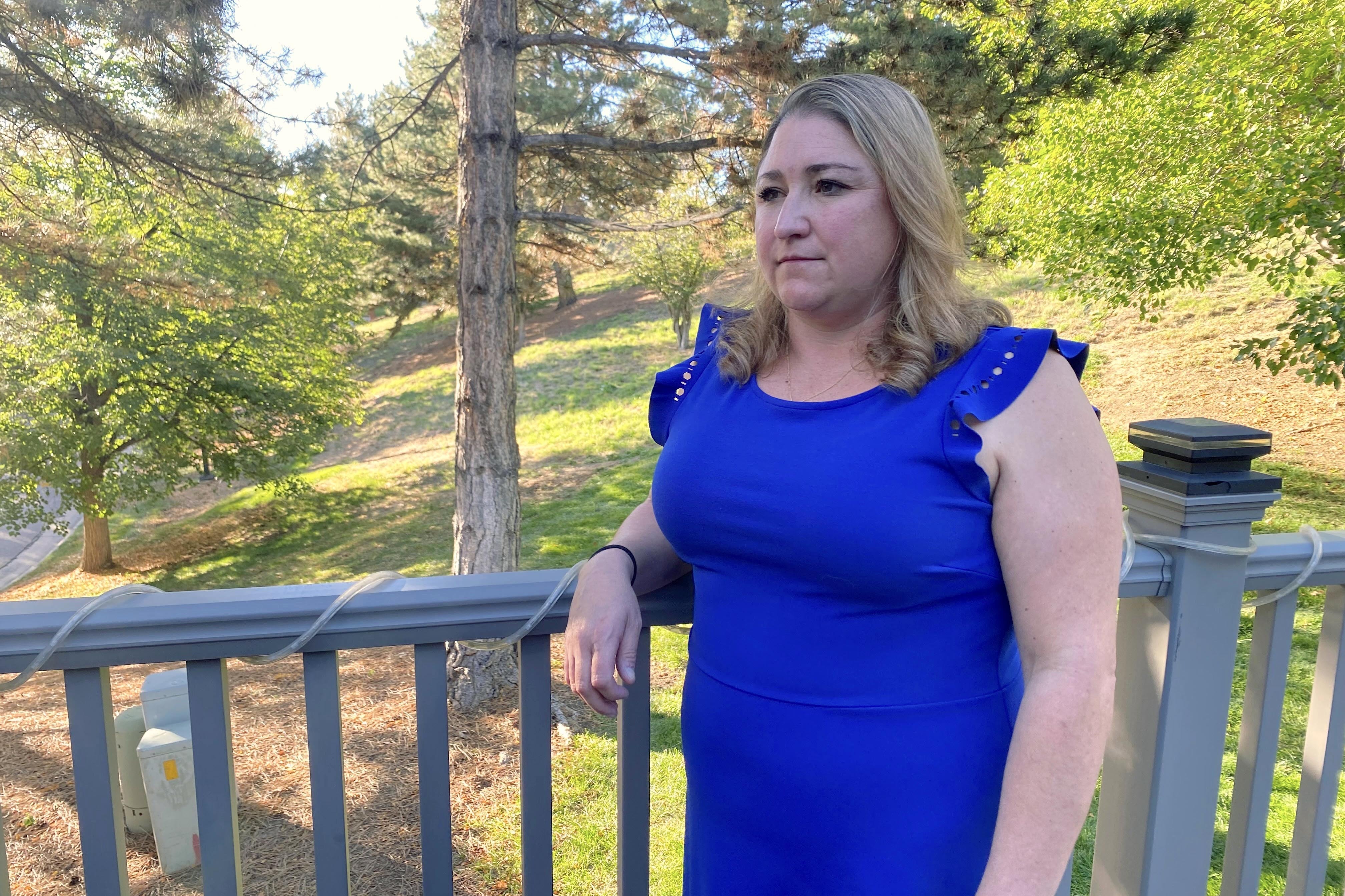 Stephanie Rogers at her mother's home outside Denver, where she and her two young daughters now live. Rogers has dipped into her retirement to help the family get through the federal shutdown. (CPR News)