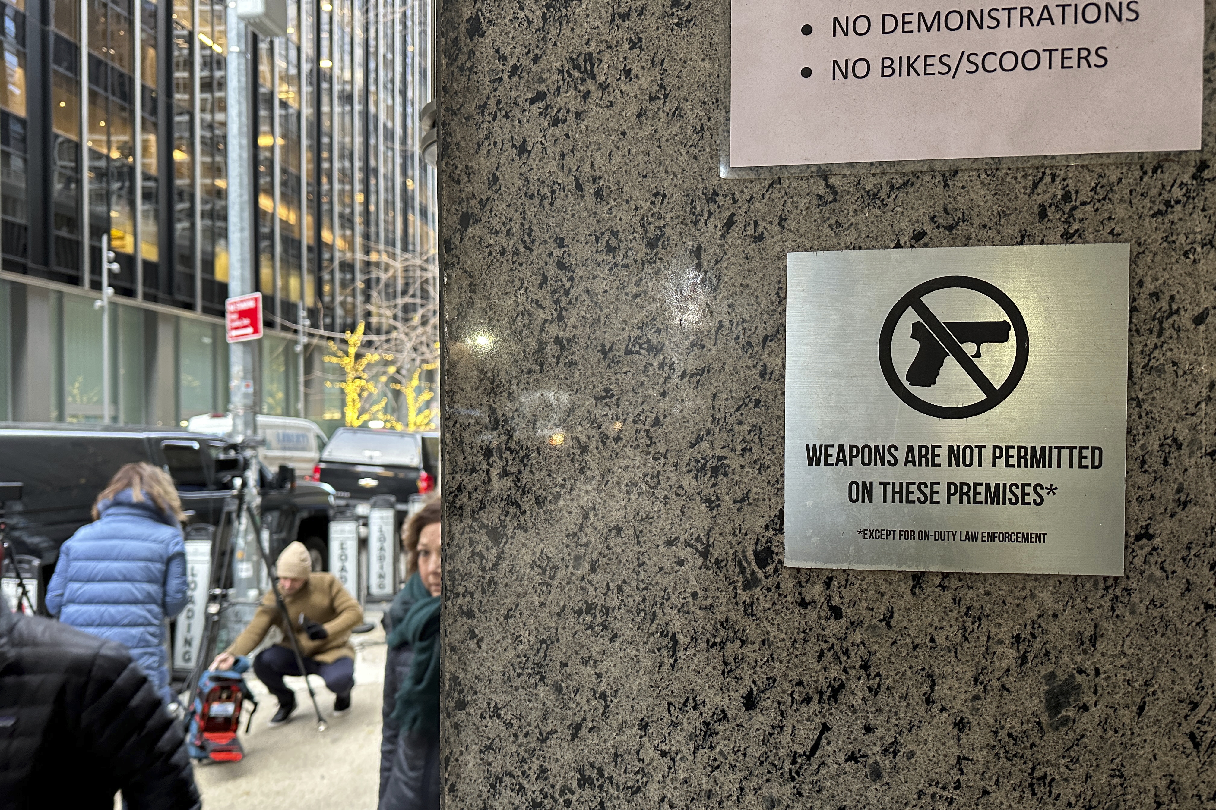 A no guns allowed sign is posted at the 54th Street entrance to the New York Hilton Midtown Hotel in New York, where Brian Thompson, the CEO of UnitedHealthcare, was fatally shot last week. (AP)