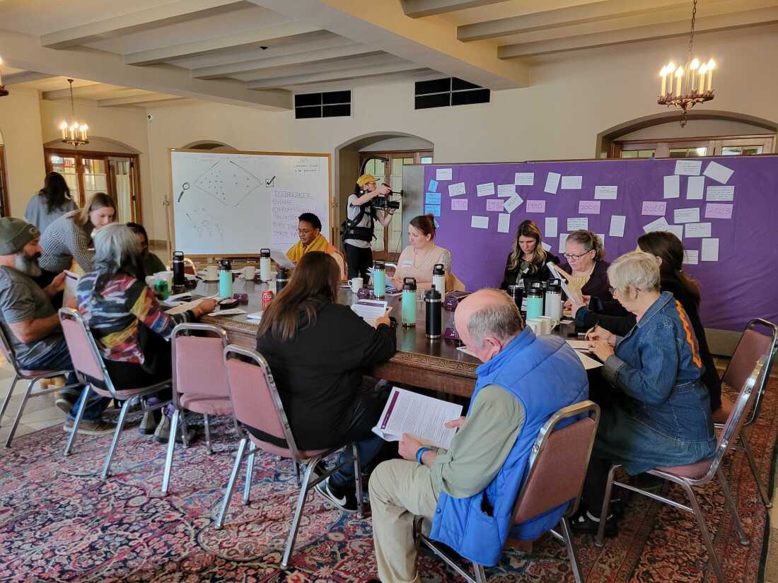 Participants study an issue guide on abortion.
