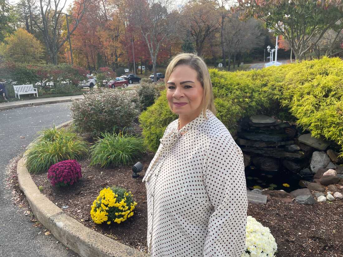 Brenda Mendoza, director of enhanced living and memory care at Loomis Lakeside in Reed's Landing, is pictured standing on the facility's grounds.