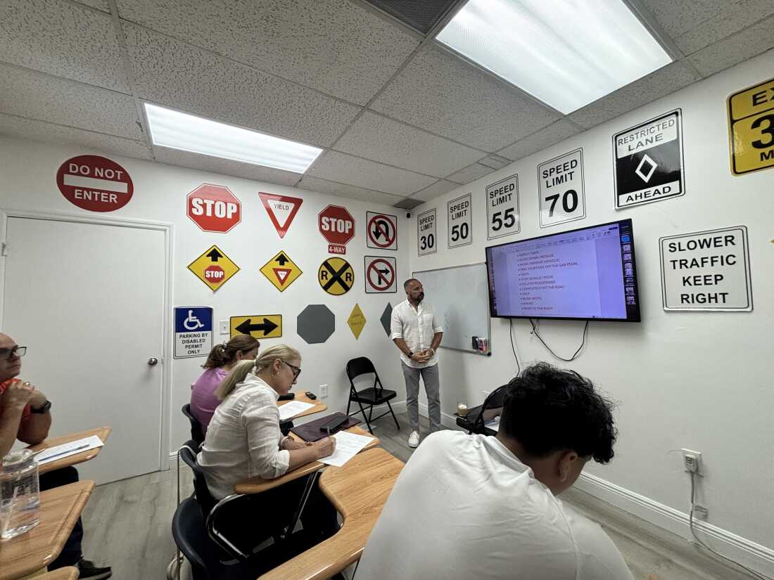Johannes González, an instructor at Speedway Driving School in Hialeah, Florida, teaches Spanish-speaking students to memorize key words in order to pass the state's new English-only driving exam.