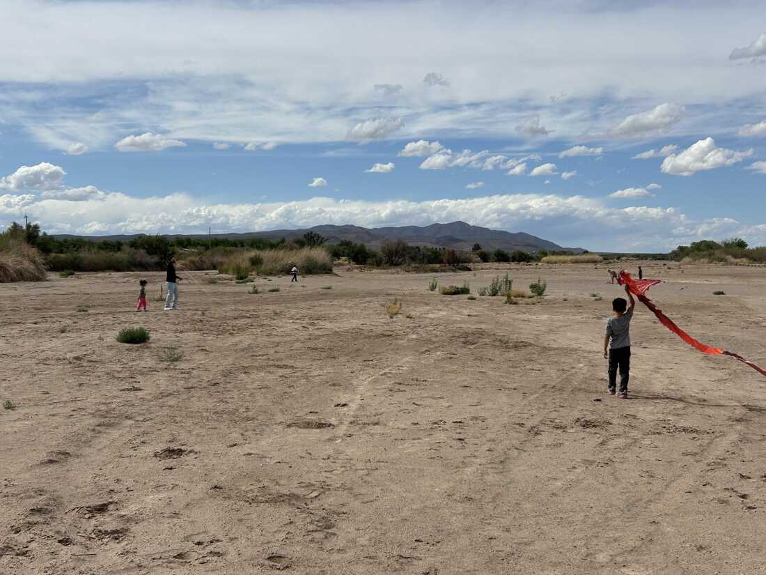 The Rio Grande is a river of sand most of the year in southern New Mexico. Here, kids fly kites in the dry riverbed in May.