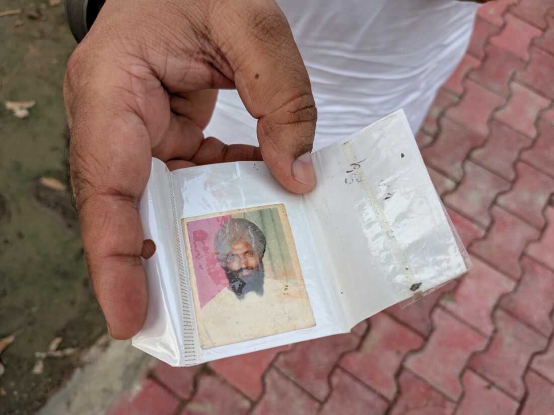 Ranjit Singh Babbar shows a photograph of his father Atma Singh who he says was abducted and killed by the Punjab police during in 1990.