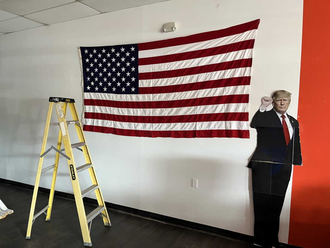 A life-sized cardboard cutout of President Trump is propped up in the Aroostook County Republican headquarters in Caribou, Maine.