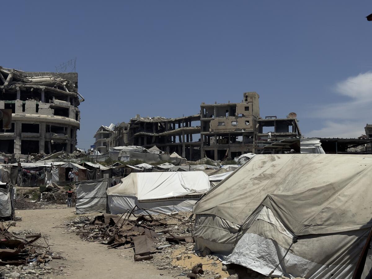 Tents stand amid the rubble of destroyed homes in al-Shujaiya, Gaza Strip, where displaced families endure harsh living conditions inside a new orange zone with nowhere else to go, on May 31.