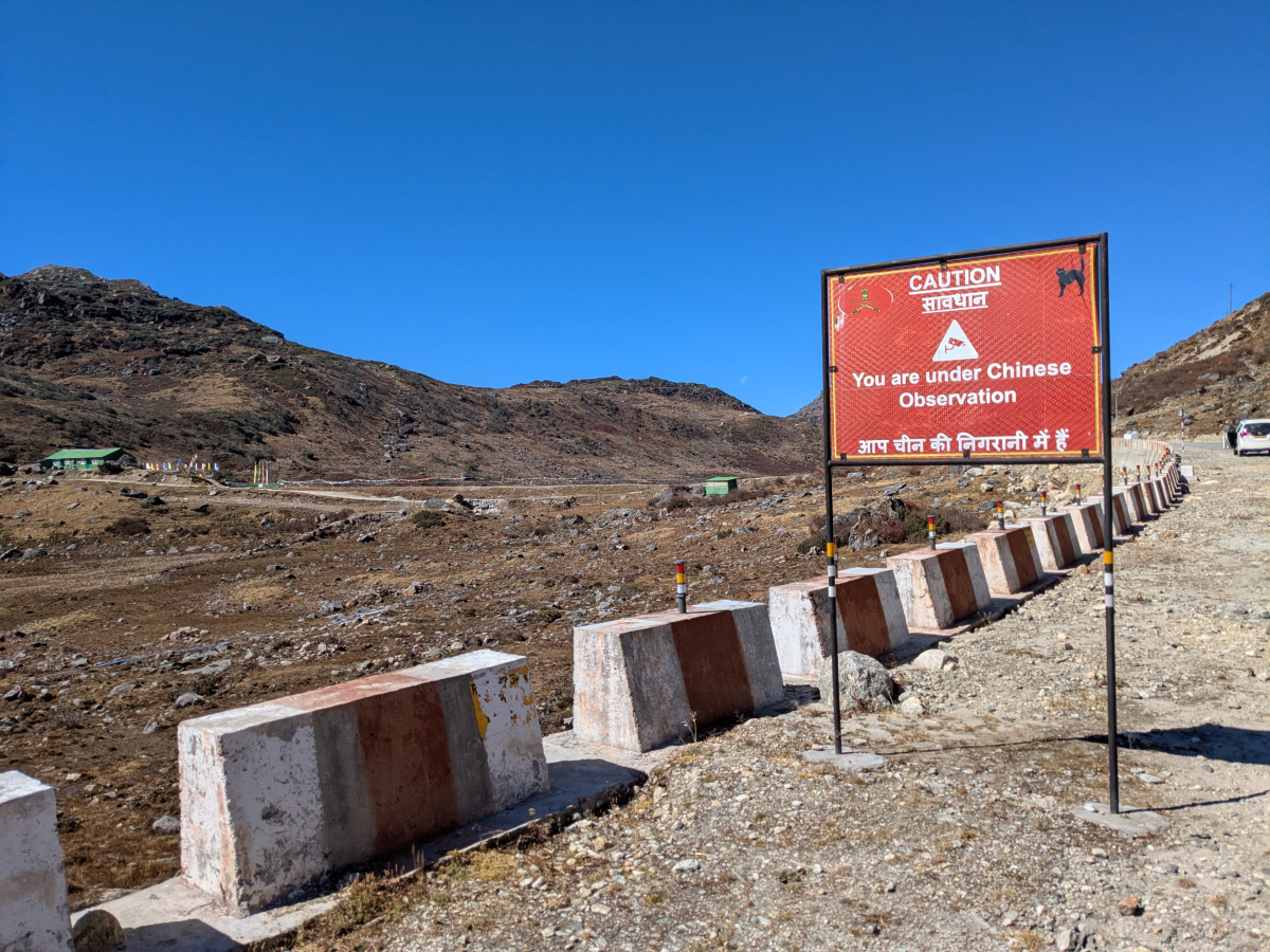 A sign in India's Sikkim state bordering China reads 'Caution: You are under Chinese observation.' In eastern parts of the state, Indian security forces have put up such signs to warn people of surveillance.