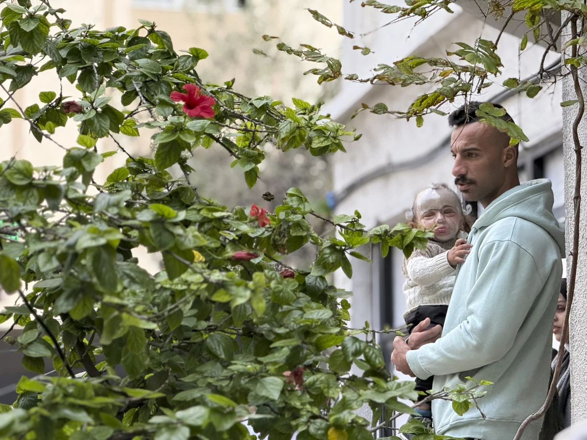 A young Palestinian child wounded in an Israeli airstrike is held by his father at MSF's clinic in Gaza City on Dec. 31, 2025.
