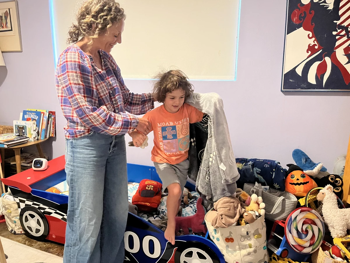 Mollie Sussman and Eli Frankel show off his new race-car bed. The 5-year-old is one of 3.6 million children in the U.S. in 2020 who are starting kindergarten this year.